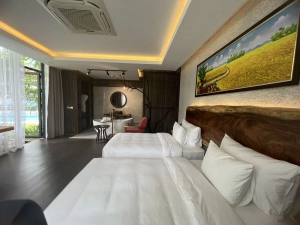 Ảnh chi tiết phòng minawa-kenhga-resort-spa-ninh-binh-phong-deluxe-giuong-doi-2-giuong-don-nhin-ra-vuon-vivatrip-04.webp