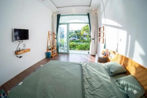 Ảnh chi tiết phòng viva-mc-green-deluxe-giuong-doi-vivatrip.jpg